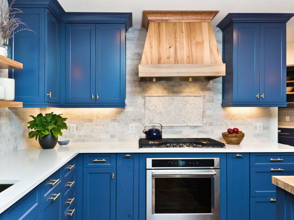 Blue cabinets in modern kitchen after cabinet painting project.