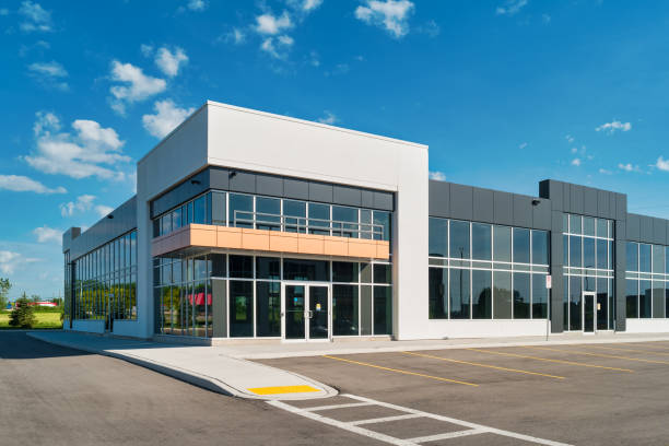 White commercial building with black and tan accents after pressure washing completion.