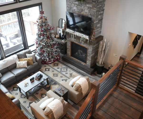 Living Room with furniture, Tv and fireplace after residential staining job completion.